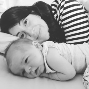 Mum and baby lying in bed