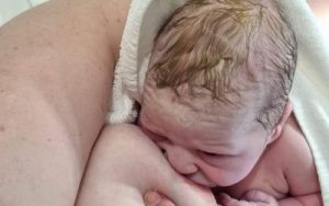 Emily breastfeeding her newborn