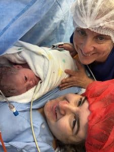 mum with newborn baby after caesarean birth