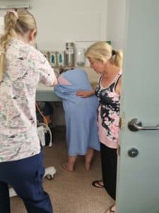 women in lean over position during labour