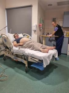 Pregnant Woman in Hospital Bed During Labor 
